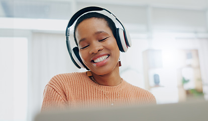 Image showing Happy, excited and black woman with headphones, home and streaming music with happiness. African person, apartment and girl with headset, listening to sound and audio with technology, app and radio