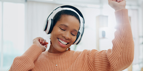 Image showing Happy, dancing and black woman with headphones, home and streaming music with happiness. African person, apartment and girl with headset, listening to sound and audio with technology and celebration