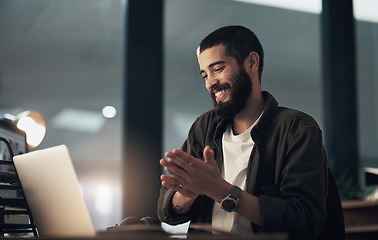 Image showing Beating deadlines is what he does best. a young businessman using a laptop during a late night at work.