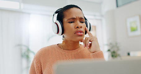 Image showing Remote work, black woman and thinking on a laptop for business, online planning or a strategy. House, music and serious African freelance worker with a podcast, headphones and streaming sound on a pc