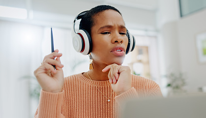 Image showing Remote work, black woman and speaking on a laptop for business, online planning or communication. House, strategy and an African freelance worker with conversation, headphones and talking on a pc