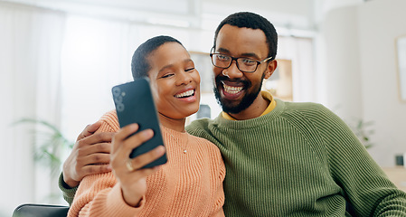 Image showing Happy, selfie and black couple on sofa online for social media, internet and profile picture. Love, dating and man and woman take photo for bonding, relationship and relax together in living room