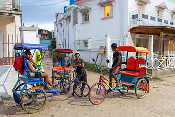 Image showing Traditional rickshaw on the city streets. Rickshaws are a common mode of transport in Madagascar.
