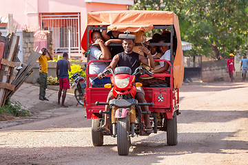 Image showing Rarely seen motor rickshaw on the city streets. Rickshaws are a common mode of transport in Madagascar.