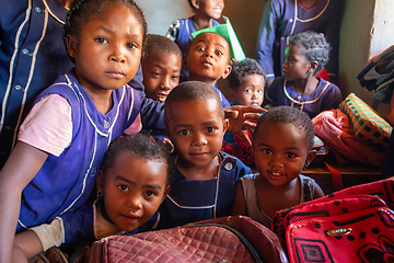 Image showing Happy Malagasy school children students in classroom. School attendance is compulsory, but many children do not go to school.