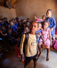 Image showing Happy Malagasy school children students in classroom. School attendance is compulsory, but many children do not go to school.