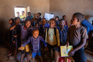 Image showing Happy Malagasy school children students in classroom. School attendance is compulsory, but many children do not go to school.