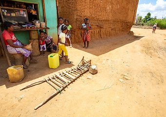 Image showing Malagasy woman resting in front of market in shadow. Vohitsoaka Ambalavao, Madagascar