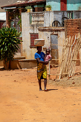 Image showing Woman carrying child on her back in Vohitsoaka Ambalavao, Madagascar