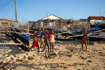 Image showing Group of Malagasy children frolicking on the beach near the fishing village of Anakao.