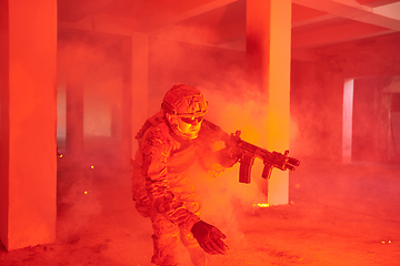 Image showing A group of professional soldiers bravely executes a dangerous rescue mission, surrounded by fire in a perilous building.