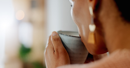 Image showing Closeup, face or woman with hands, coffee and drinking a beverage for morning, relax or break in living room of home. Person, tea or drink espresso, cappuccino or latte for peace or comfort in lounge