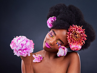 Image showing Substitute synthetic chemicals with flower and plant extracts. Studio shot of a beautiful young woman posing with flowers in her hair.