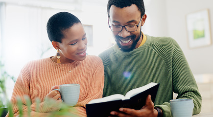 Image showing Home, relax and black couple with smile, reading a book or relax with religion, love or bonding together. Romance, apartment or man with woman, scripture or bible with Christian, hope or conversation