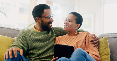 Image showing Hug, home tablet and black couple happy for social media post, morning wellness blog or relationship romance. Living room sofa, eye contact and African man, woman or marriage people embrace for love