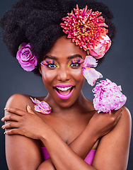 Image showing Life may not be perfect but my makeup is. Studio shot of a beautiful young woman posing with flowers in her hair.