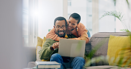 Image showing Happy, couple hug and laptop for social media, internet search or reading an email. Smile, love and an African man and woman with care, connection and a computer for a movie, show or film together