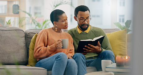 Image showing Home, relax and black couple on a couch, bible and reading with religion, love and bonding together. Romance, apartment or man with woman, scripture and holy book with Christian, hope or conversation