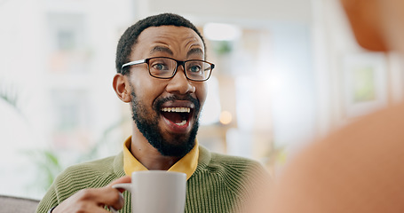 Image showing Coffee, surprise conversation and excited man at home on a living room sofa with a man and hot drink. Couple, tea and smile with communication and conversation together with love and support on couch