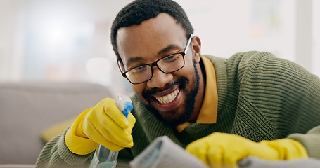 Image showing Cleaning, happy and man with spray for furniture in living room for hygiene, housework and maintenance in home. Housekeeping, products and person with gloves for bacteria, dirt and dust on surface