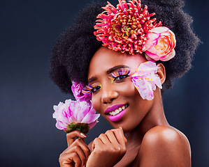 Image showing Darling, be daring. Studio shot of a beautiful young woman posing with flowers in her hair.