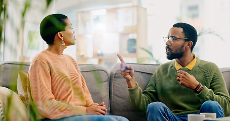 Image showing Fight, couple and home with marriage stress, frustrated and angry man on a living room sofa. Mistake, yelling and conversation of people with argument, fail and conflict with divorce discussion