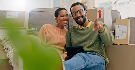 Image showing African couple, pointing and new home with tablet, boxes and thinking with discussion, decision and choice. Black woman, man and floor for planning, moving or chat for real estate, property or house