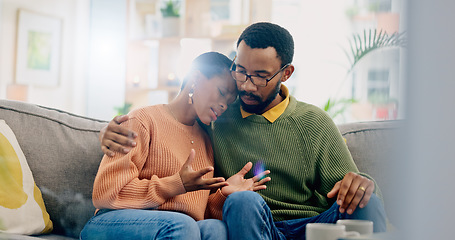 Image showing Sad, home and black couple with hug, conversation and emotions with discussion, grief and loss. People, apartment and man with woman, embrace or talking with reaction, crying and support with anxiety