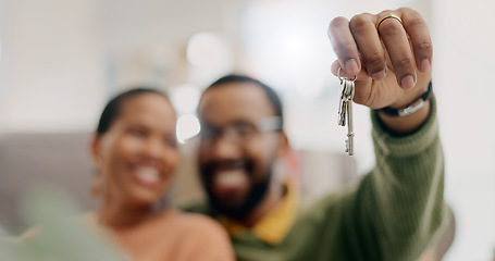 Image showing Hand, keys and couple with closeup in new home for fresh start, property or real estate investment with smile. African man, woman and happy for apartment, house and mortgage in blurred living room