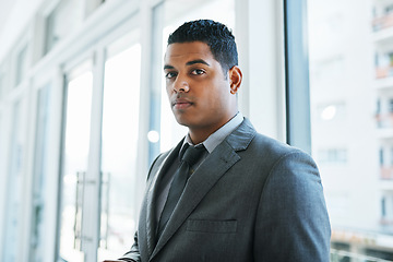 Image showing Know what this suit is made of Management material. Portrait of a confident young businessman working in a modern office.