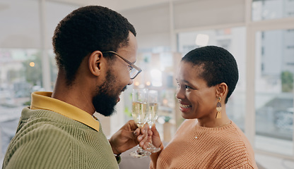 Image showing Home, cheers and black couple with love, champagne and romance with happiness, excited or care. Romantic, man and woman with alcohol, relationship or celebration with support, anniversary or marriage