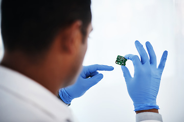 Image showing He knows computer hardware like the back of his hand. a young man repairing computer hardware in a laboratory.