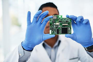 Image showing Nothing is too complicated for a technician like him. a young man repairing computer hardware in a laboratory.