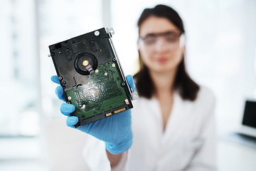 Image showing Repaired and ready for use. a young woman repairing computer hardware in a laboratory.