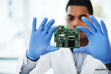 Image showing Tech support to the rescue. a young man repairing computer hardware in a laboratory.