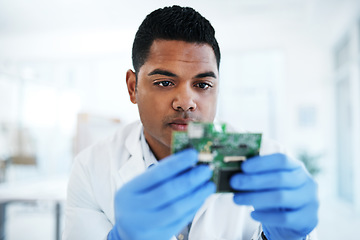 Image showing The savant in IT system maintenance. a young man repairing computer hardware in a laboratory.