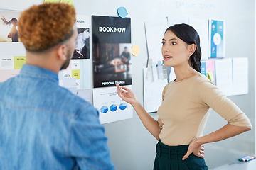 Image showing Business is about keeping an eye on your competitors too. a young businesswoman having a discussion with a colleague in an office.