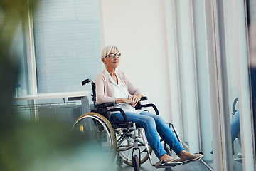 Image showing So many pages of memories to turn back on. Full length shot of a senior woman looking thoughtful while sitting in her wheelchair at a retirement home.