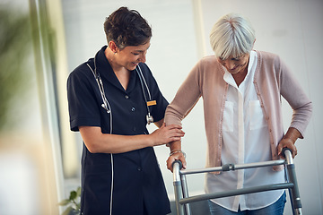 Image showing Youve walked so far already. a young female nurse assisting a senior woman walk using a walker in a nursing home.