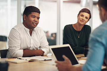 Image showing Looks like the meetings going well. a group of business colleagues sitting around a table in the boardroom during a meeting.