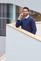 Image showing Alls well when my clients are happy. Portrait of a young businessman talking on a cellphone in an office.