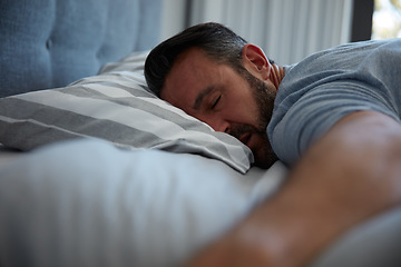 Image showing The best stage of the day. an attractive mature man fast asleep on his bed at home.