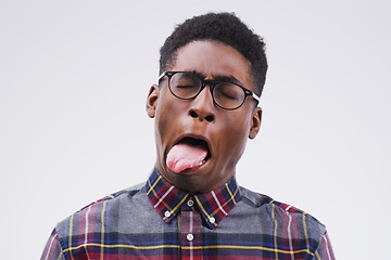 Image showing Nah I dont like it. Studio shot of a young man making a funny face against a gray background.