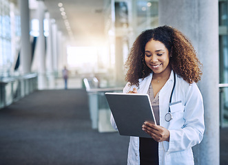 Image showing With the right tools, you can save lives. a female doctor using a digital tablet.