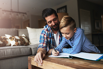 Image showing Parents play an active role in a childs educational upbringing. a father helping his little son with his homework.