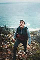 Image showing You wont find new paths unless you wander. a young man hiking through the mountains.