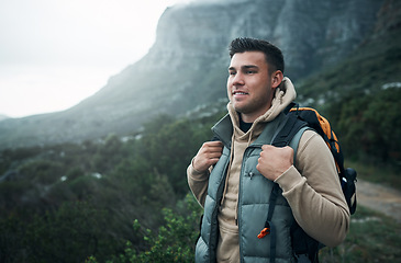 Image showing Whenever I visit nature, I see it differently each time. a young man hiking through the mountains.