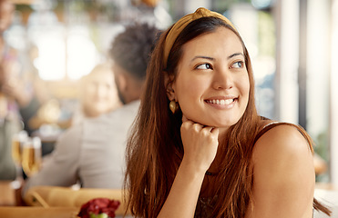 Image showing Dreaming of fun days. a young woman enjoying some alone time at a cafe.