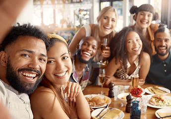 Image showing The best people to have around. a group of young friends taking selfies together at a restaurant.