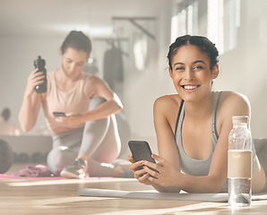 Image showing My medical aid rewards me for all the healthy choices I make. two young female athletes taking a break while at the gym.